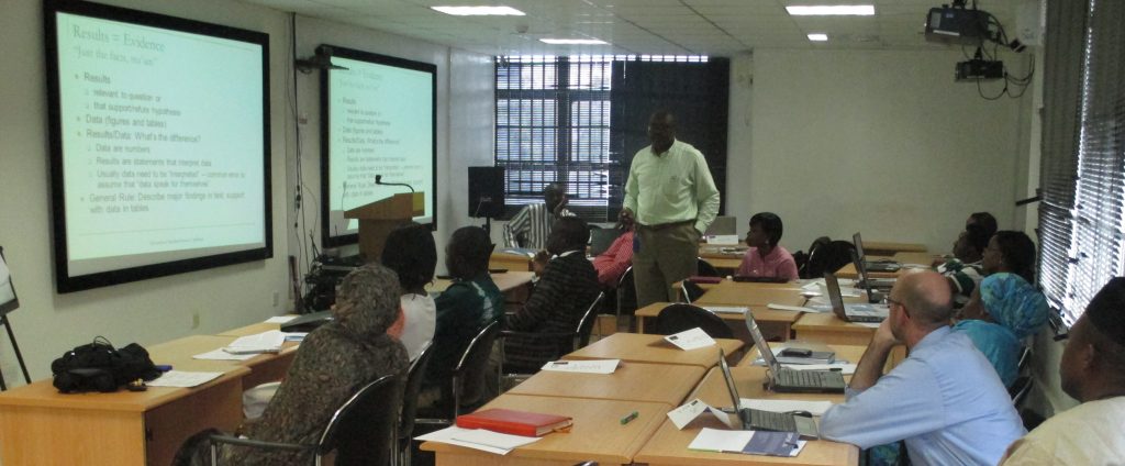Course participants listen to Dr. Ndembi present